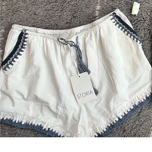 Storia white shorts + Kenneth Cole earrings